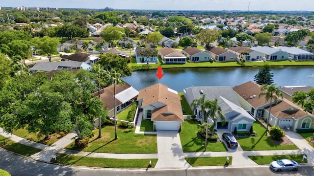 aerial view featuring a residential view and a water view