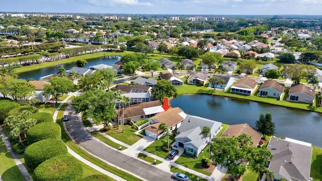 bird's eye view featuring a residential view and a water view