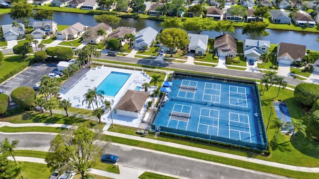 bird's eye view featuring a water view and a residential view