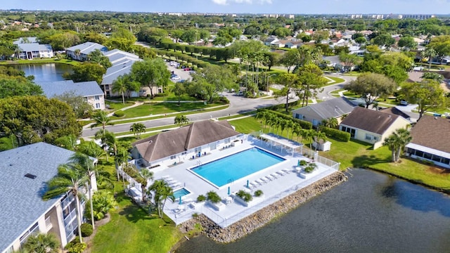 drone / aerial view with a residential view and a water view