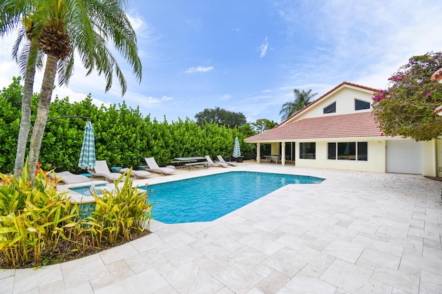 pool with a patio area