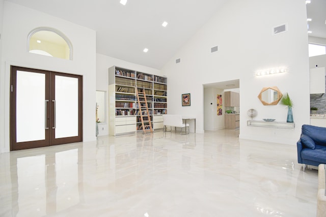 interior space with a high ceiling, french doors, visible vents, and marble finish floor