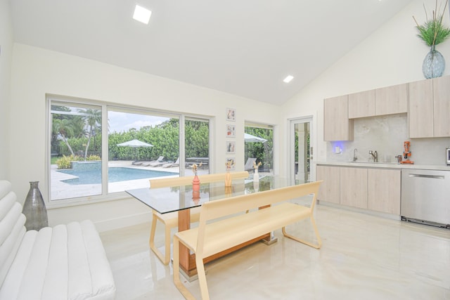 dining area with recessed lighting and high vaulted ceiling