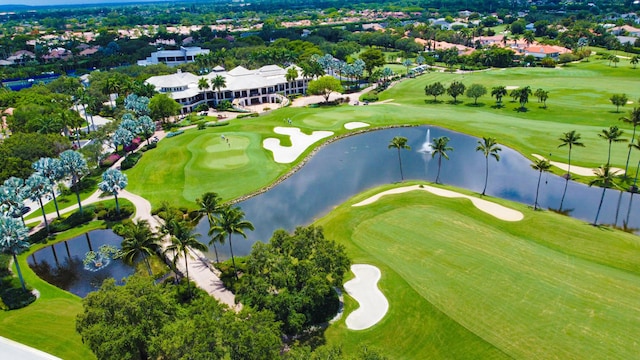 aerial view featuring a water view and view of golf course