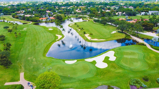 aerial view with view of golf course and a water view