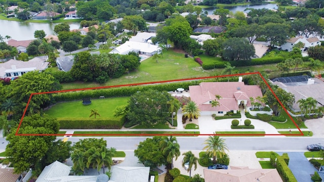 bird's eye view featuring a water view and a residential view