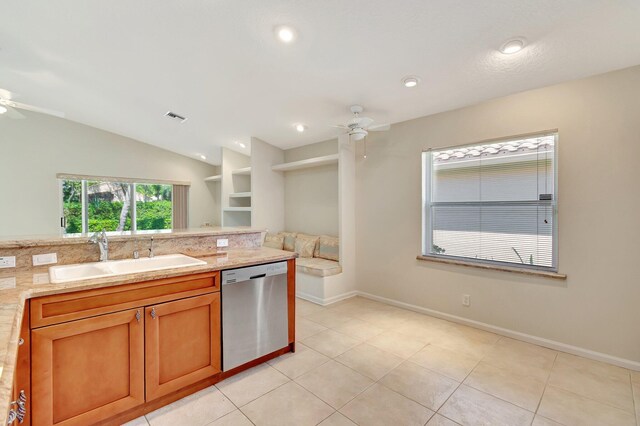 kitchen with visible vents, a ceiling fan, dishwasher, vaulted ceiling, and a sink