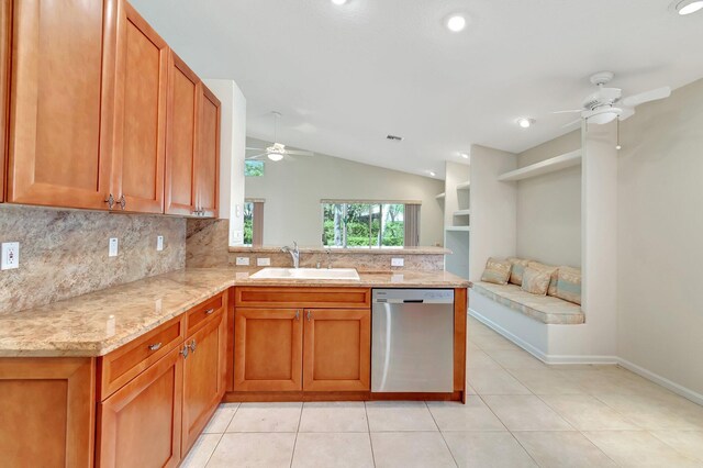 kitchen featuring ceiling fan, a peninsula, a sink, decorative backsplash, and dishwasher