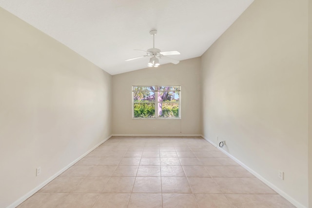 unfurnished room with baseboards, vaulted ceiling, a ceiling fan, and light tile patterned flooring