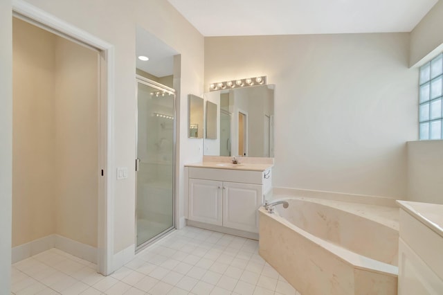 bathroom featuring a bath, a stall shower, vanity, and tile patterned floors