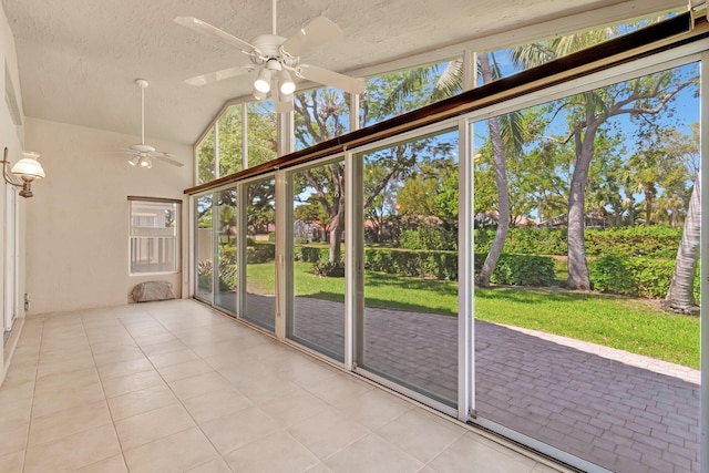 unfurnished sunroom with lofted ceiling and ceiling fan