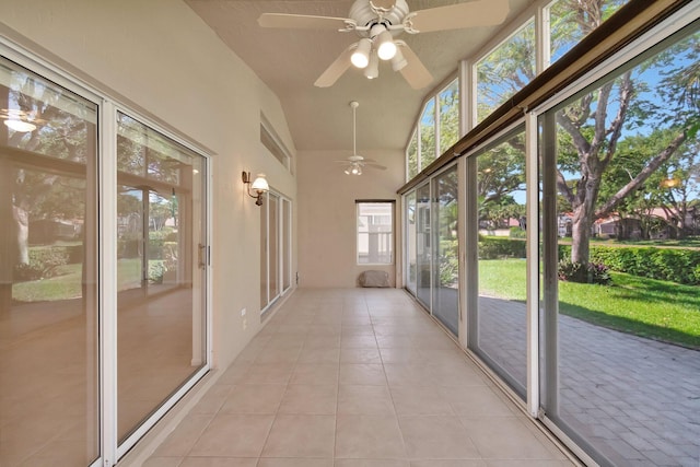 unfurnished sunroom featuring lofted ceiling