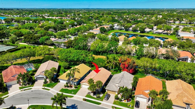 bird's eye view with a residential view and a water view