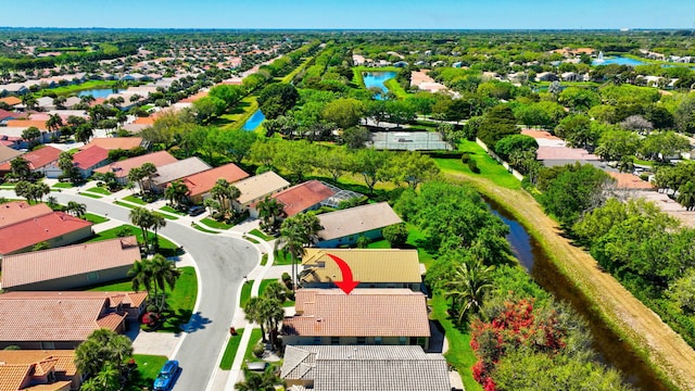 bird's eye view featuring a water view and a residential view