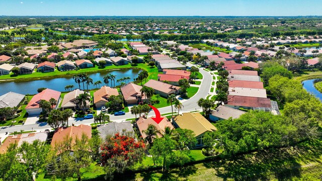 birds eye view of property featuring a water view and a residential view