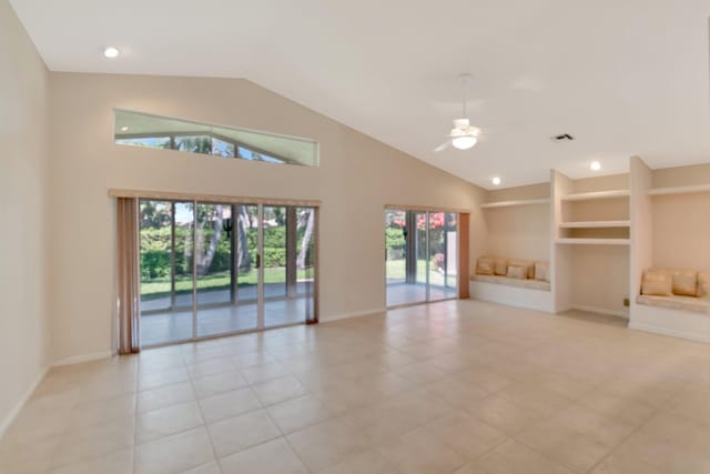 unfurnished living room featuring high vaulted ceiling, recessed lighting, a ceiling fan, and baseboards