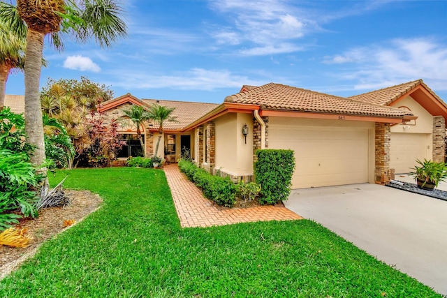 mediterranean / spanish home with a front yard, stucco siding, concrete driveway, a garage, and a tile roof