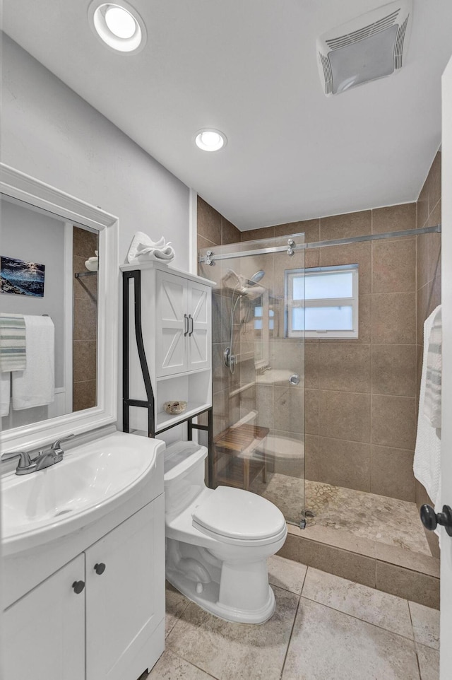 full bathroom with visible vents, toilet, a stall shower, recessed lighting, and vanity