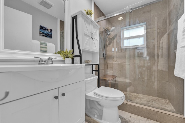 full bathroom featuring visible vents, a shower stall, toilet, and vanity