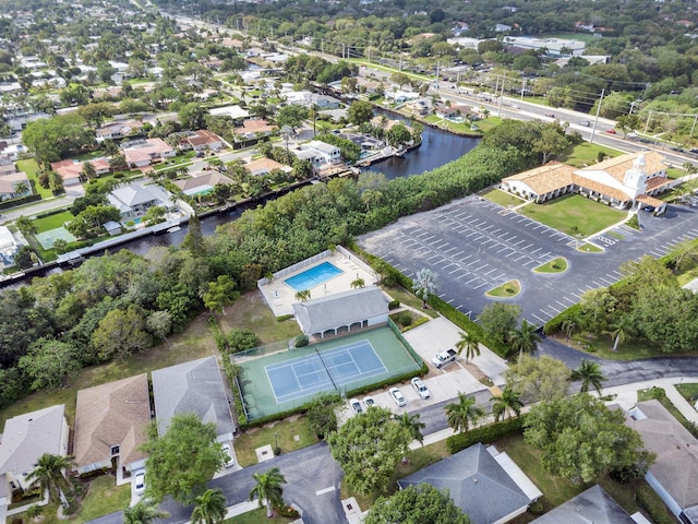 birds eye view of property featuring a residential view and a water view