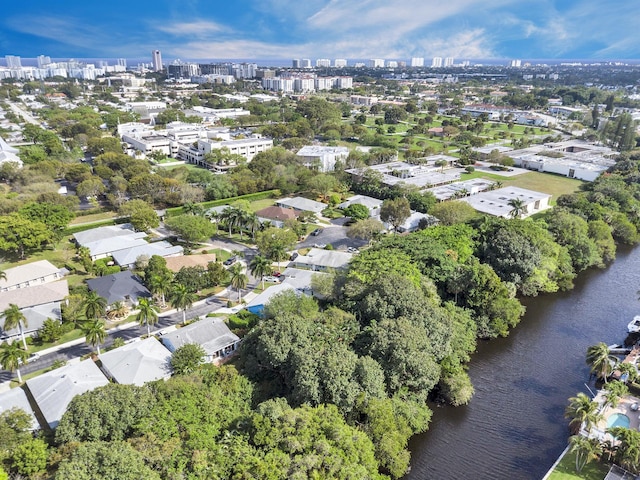 birds eye view of property with a view of city and a water view