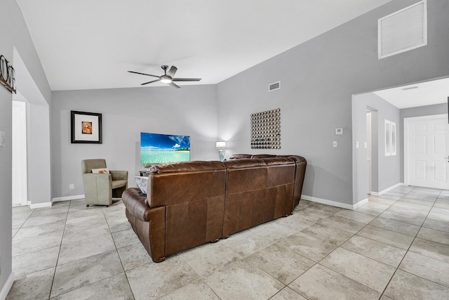 living area with visible vents, lofted ceiling, baseboards, and ceiling fan