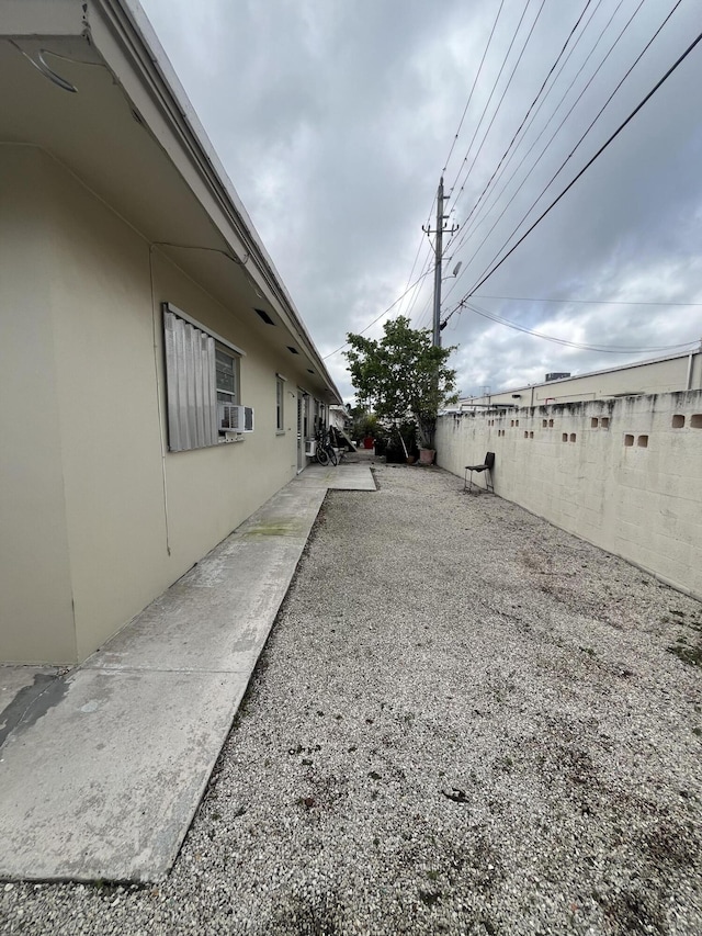 view of yard with cooling unit and a fenced backyard