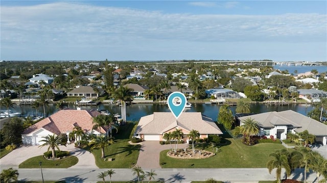 bird's eye view featuring a water view and a residential view