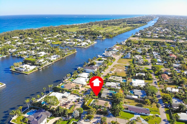 bird's eye view featuring a water view and a residential view