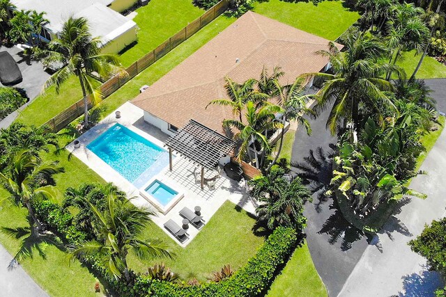 birds eye view of property with a water view and a residential view