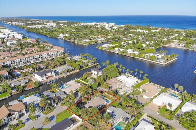 drone / aerial view with a residential view and a water view