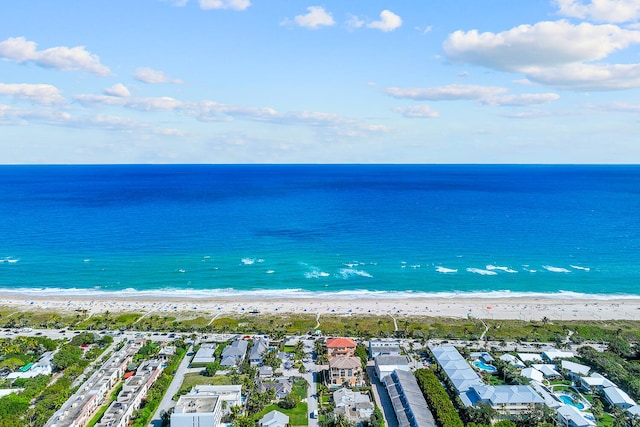 aerial view featuring a water view, a residential view, and a beach view