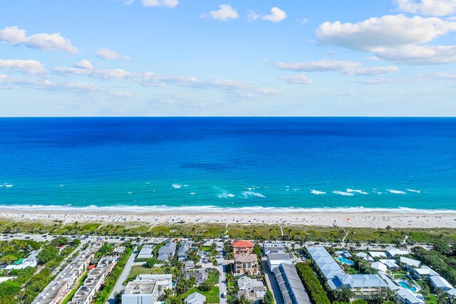 bird's eye view featuring a city view, a beach view, and a water view