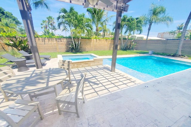 view of pool featuring an in ground hot tub, a patio area, a fenced backyard, and a fenced in pool