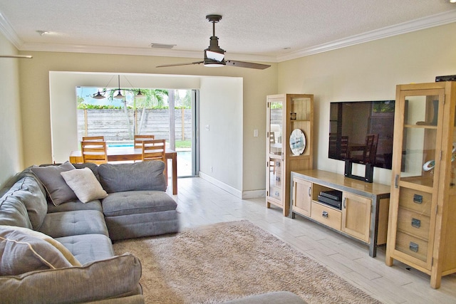 living area with crown molding, visible vents, a ceiling fan, a textured ceiling, and light wood-type flooring