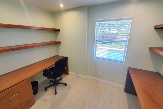 office with recessed lighting, baseboards, built in study area, and light wood finished floors