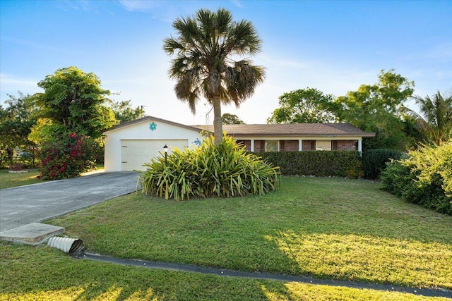 single story home featuring aphalt driveway, a front lawn, and a garage