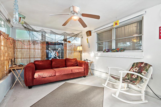 sunroom featuring a ceiling fan