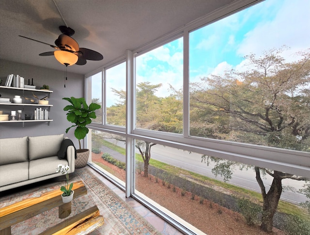 sunroom featuring a ceiling fan