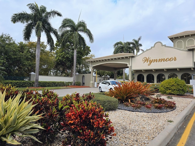 exterior space featuring a carport and driveway