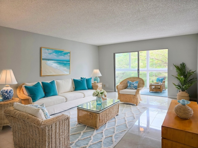 tiled living area featuring a textured ceiling