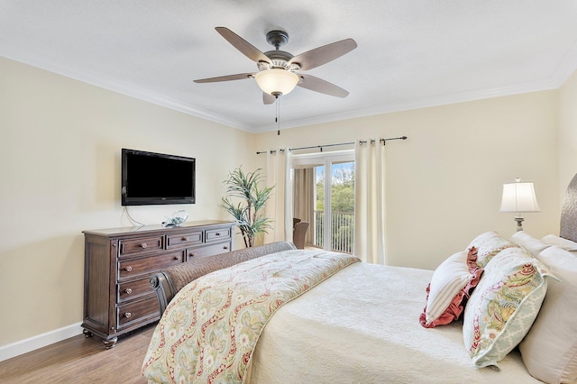 bedroom featuring access to exterior, light wood-style flooring, ornamental molding, and baseboards