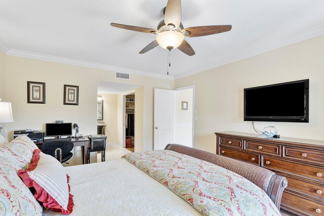 bedroom featuring a ceiling fan, connected bathroom, visible vents, and crown molding