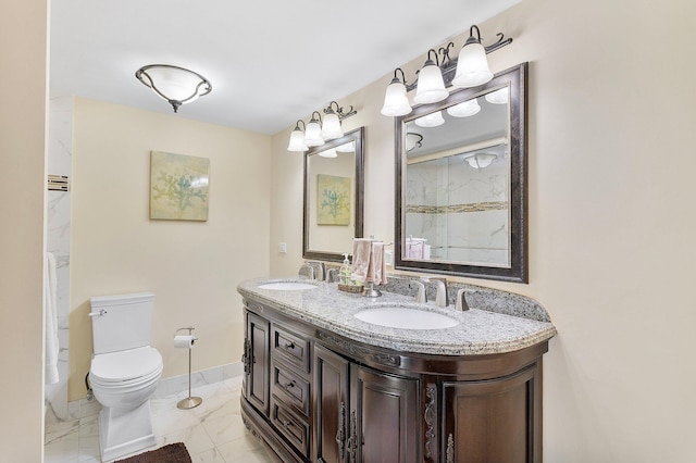 bathroom with marble finish floor, a sink, toilet, and baseboards