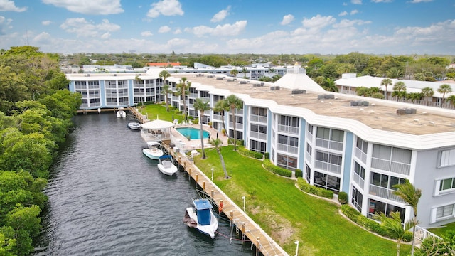 birds eye view of property with a water view