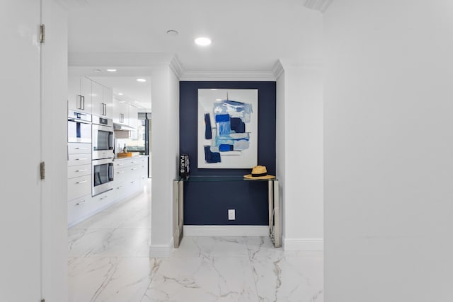 hall featuring recessed lighting, marble finish floor, crown molding, and baseboards