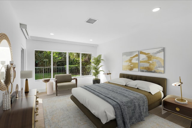 bedroom with visible vents, recessed lighting, and wood finished floors