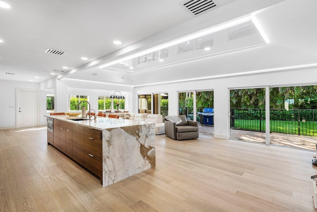 sunroom / solarium with a sink and visible vents