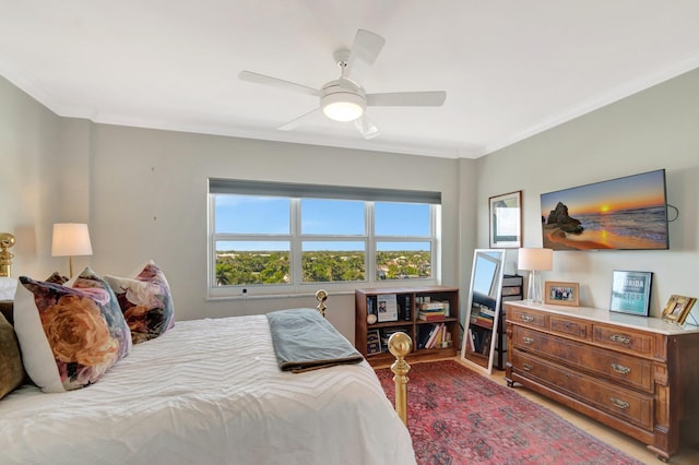 bedroom with ceiling fan and crown molding