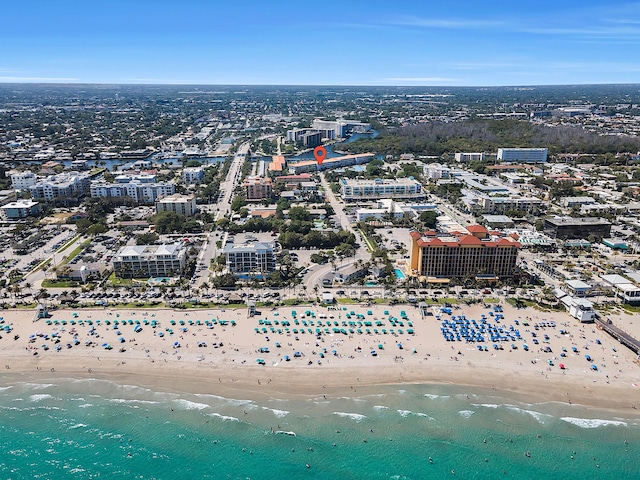 aerial view featuring a view of the beach and a water view